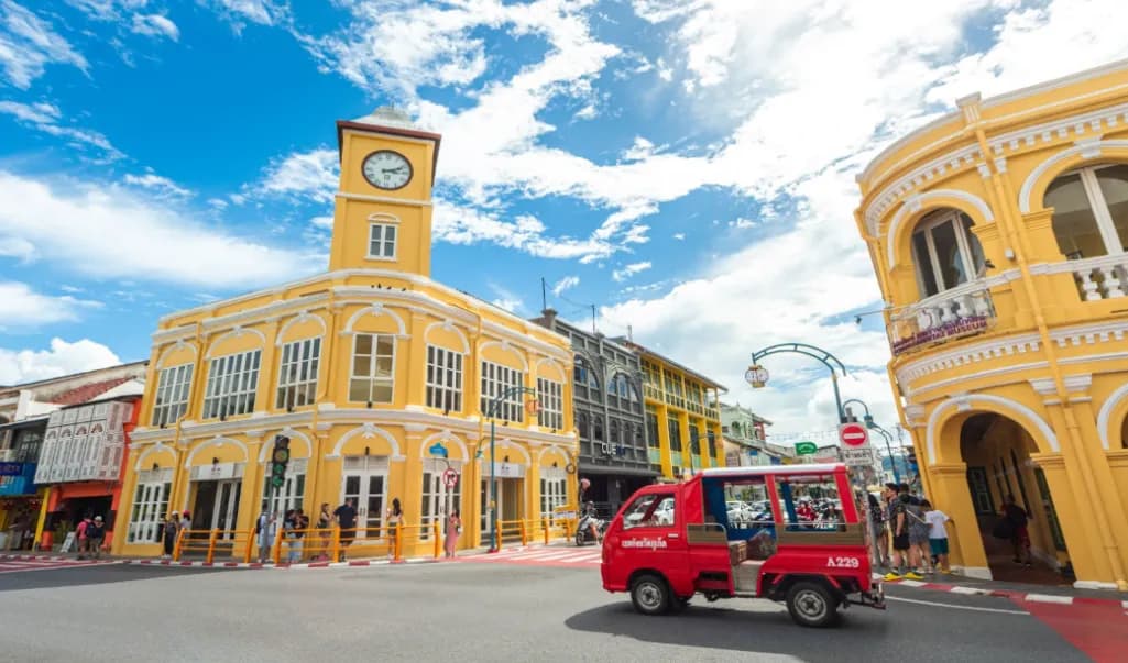 Phuket Old Town Sino-Portuguese architecture with iconic yellow buildings and a red tuk-tuk in Thailand, TGTF 2026